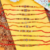 Dhiyona Set Of 10 Artificial Stones & Beads Thread Rakhi With Roli Chawal Chandan Mishri