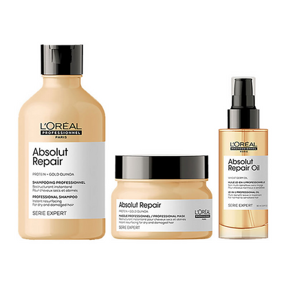 L'Oreal Paris Serie Expert Absolut Repair hair mask, shampoo, and serum for damaged hair, shown in a set of beauty products.