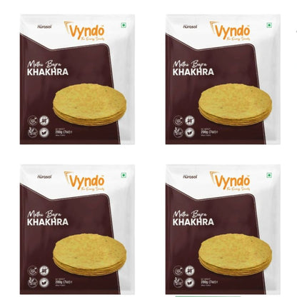 Vyndo Methi Bajra Khakhra, North Indian snack with crispy, seasoned bajra and methi, served in a clear plastic package.