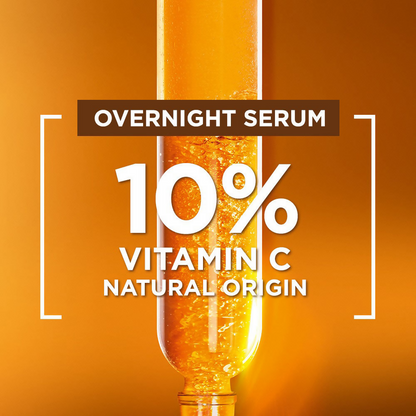 Garnier Bright Complete Vitamin C Night Serum in a small glass bottle with a dropper for glowing skin.