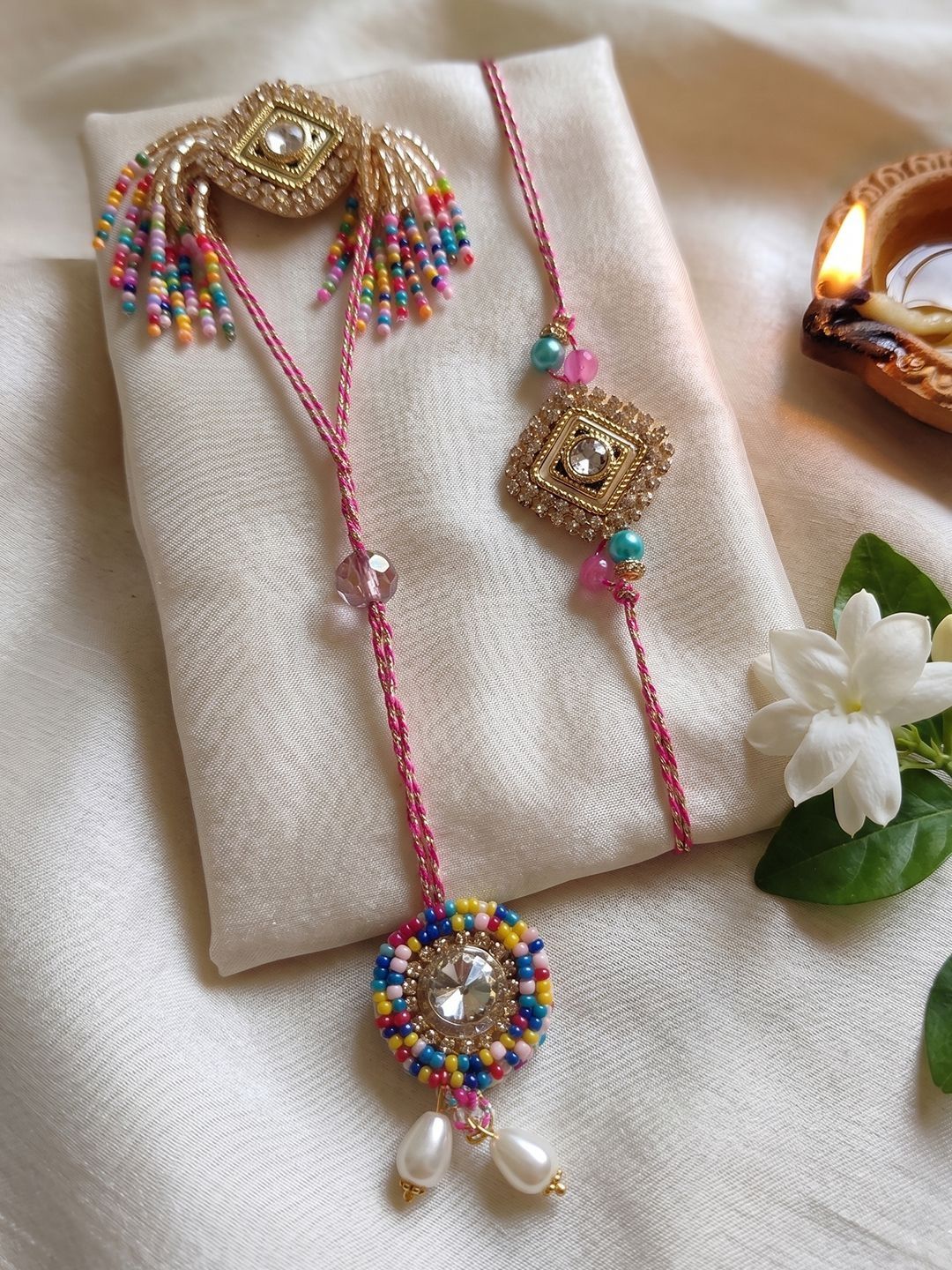 Anouk Set Of 2 White Artificial Stones Golden Toned Bhaiya Bhabhi Rakhi With Roli Chawal