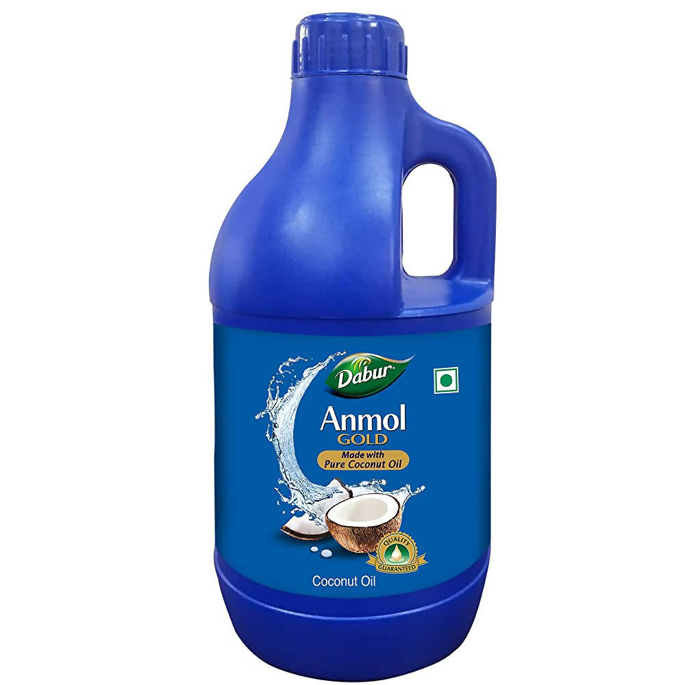 Dabur Anmol Gold pure coconut oil bottle, natural hair care product for healthy, shiny hair, in a clear plastic container.