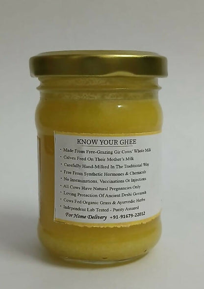 Satjeevan Organic Vedic Gir Cow Bilona Ghee jar showing golden, clarified cow ghee in a glass container with traditional packaging