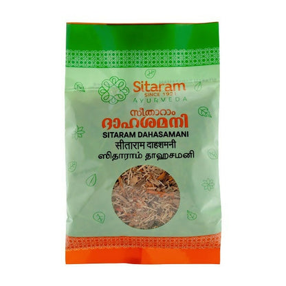 Sitaram Ayurveda Dahashamani Ayurvedic powder in a glass jar with a scoop, showcasing the herbal supplement's texture.