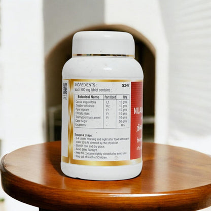Impcops Nilavarai Chooranam Ayurvedic Churna in a glass bowl, showing fine herbal powder for traditional health remedy.