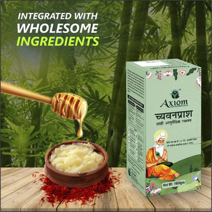 Axiom Royal Ayurvedic Chyawanprash jar with herbal ingredients and traditional packaging on a wooden surface.