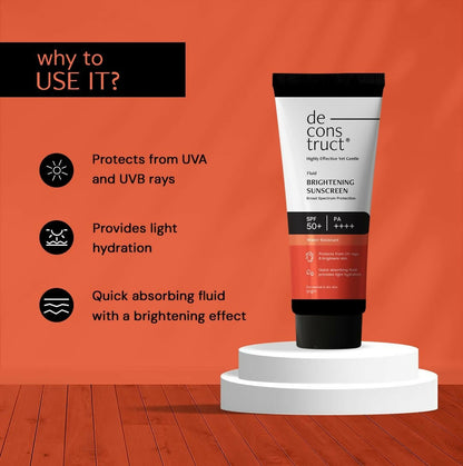 Deconstruct Fluid Brightening Sunscreen SPF 50+ and PA++++ in a sleek tube, designed for effective sun protection and skin brightening