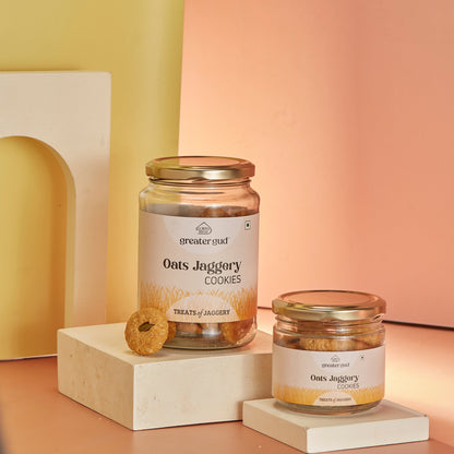 Oats jaggery cookies in a jar from Almond House, showcasing golden oat biscuits with jaggery pieces on top.