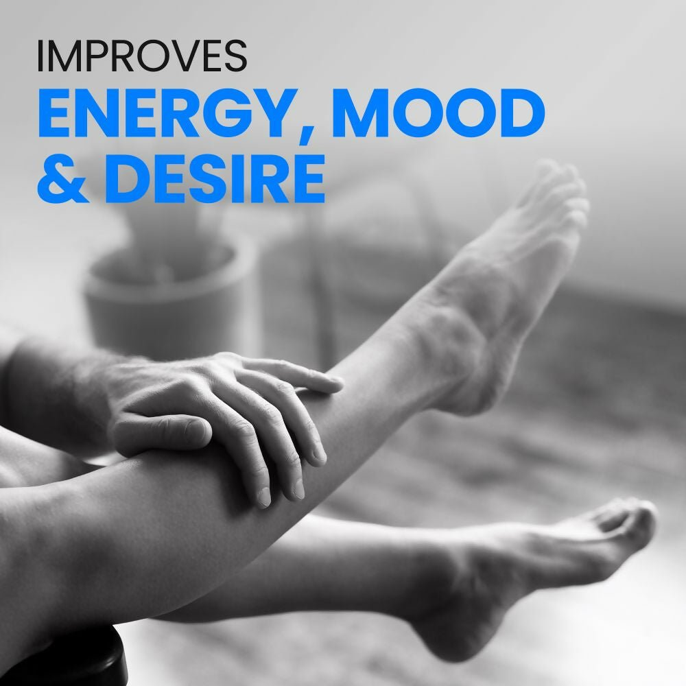 Auric Men's Energy++ Ayurvedic effervescent tablets in a clear glass with tablets and a glass of water on a wooden table