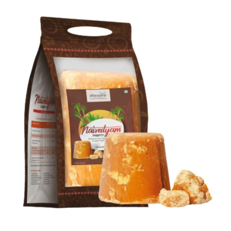 Pure Naivedyam chemical-free jaggery cubes, showing golden brown, textured blocks ideal for natural sweetening in recipes.