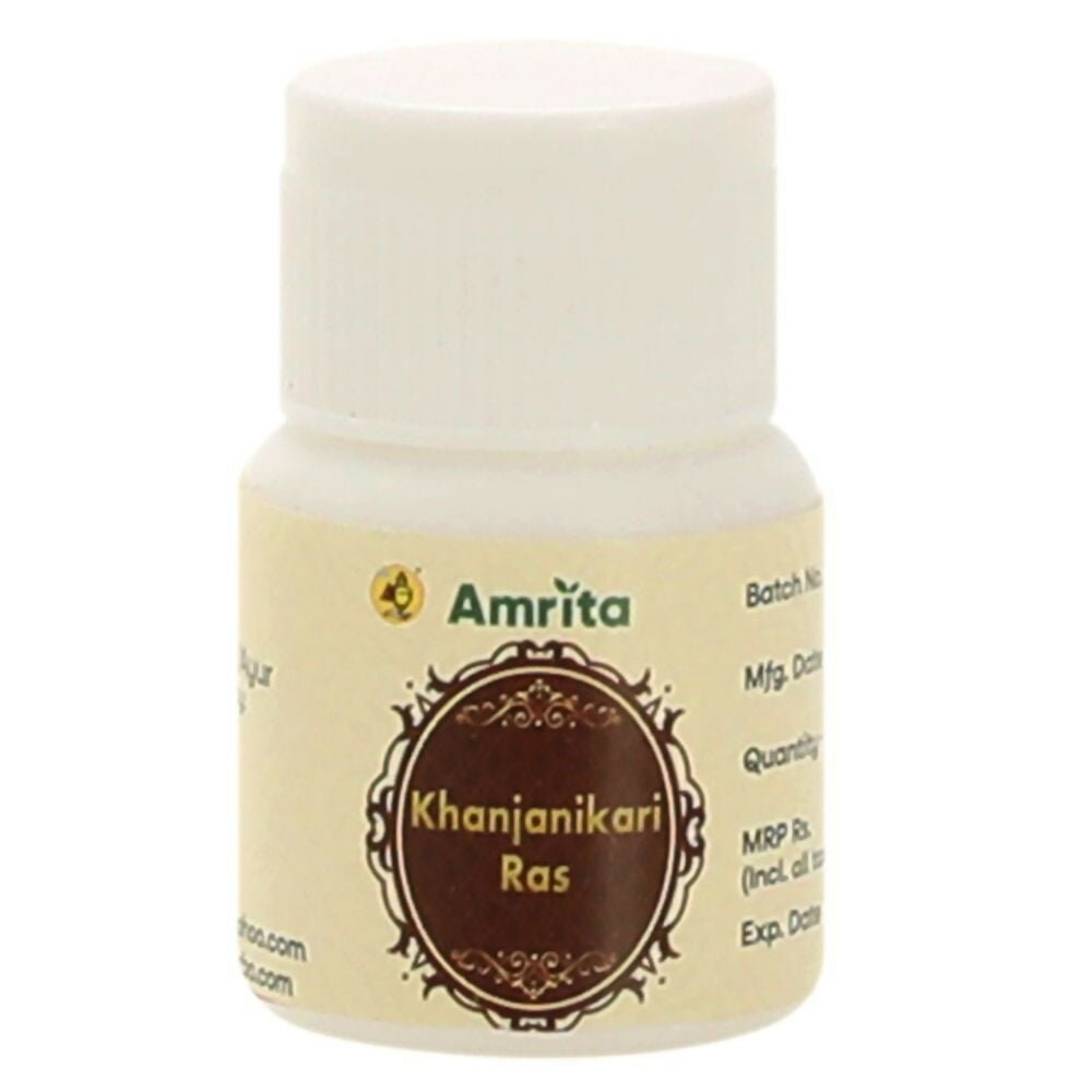 Amrita Khanjanikari Ras Ayurvedic tablets in a glass container, showing traditional herbal tablets used in Ayurvedic medicine.