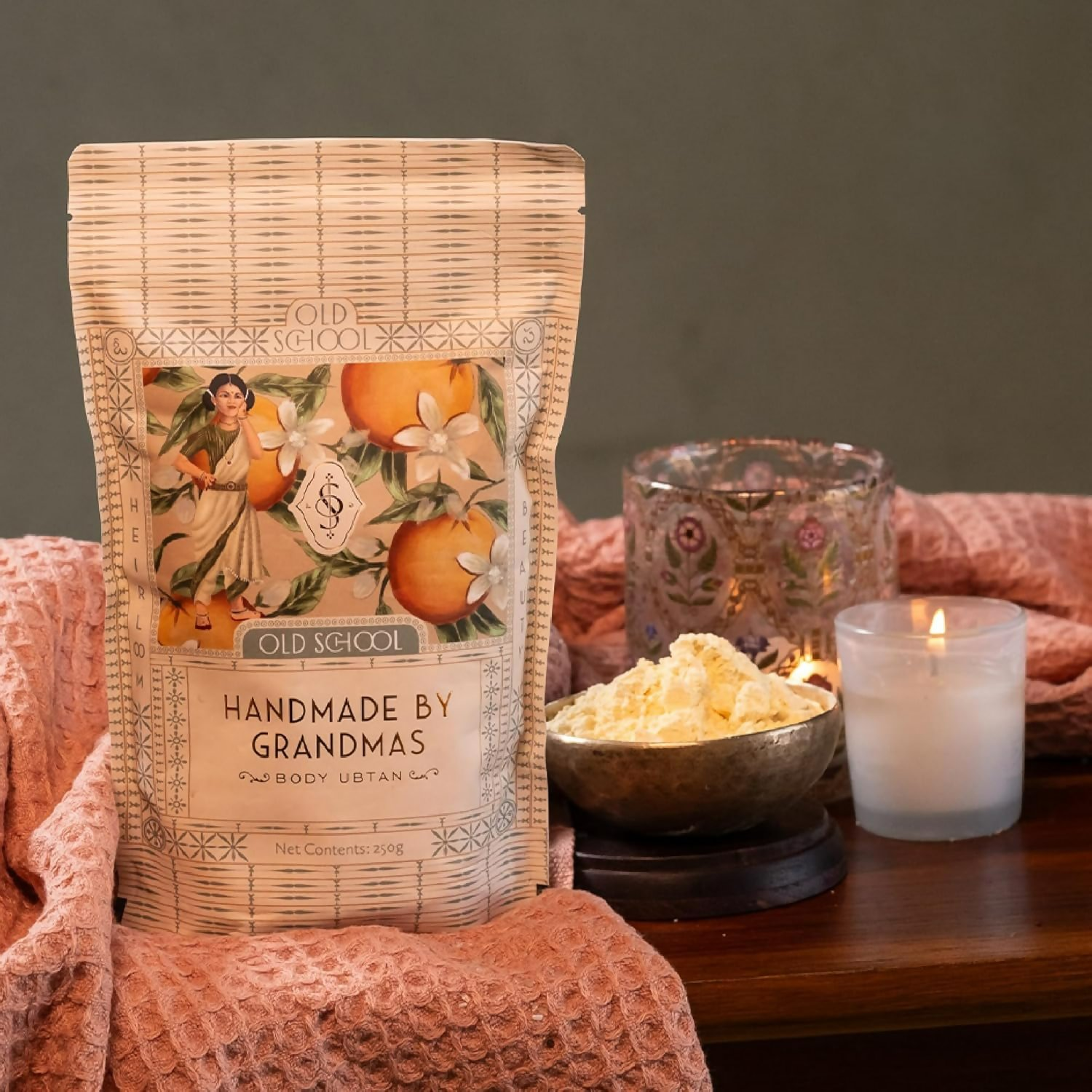 Old School Rituals handmade baby body ubtan natural bath powder in a bowl with dried herbs and traditional ingredients for gentle skin care.