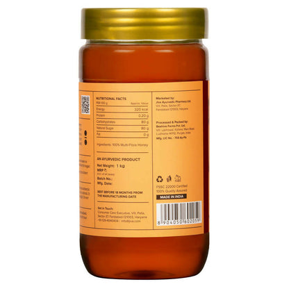 Jiva Ayurveda honey jar with a golden honey spread and natural packaging, showcasing pure Ayurveda honey product.