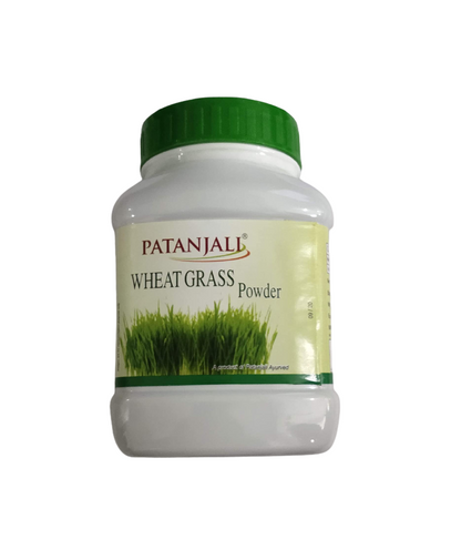 Patanjali Wheat Grass Powder in a clear plastic jar with a green label, showing the powder inside and natural packaging.