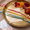 Dhiyona Set Of 4 Multicolor Artificial Beads Thread Rakhi With Roli Chawal Chandan Mishri