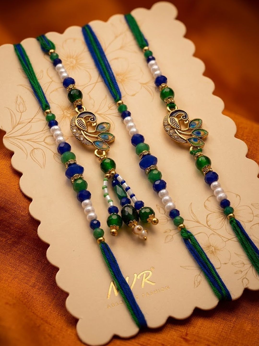 Anouk Set Of 4 Green Peacock Design Artificial Beads Thread Rakhi With Roli Chawal
