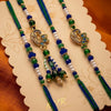 Dhiyona Set Of 4 Green Peacock Design Artificial Beads Thread Rakhi With Roli Chawal