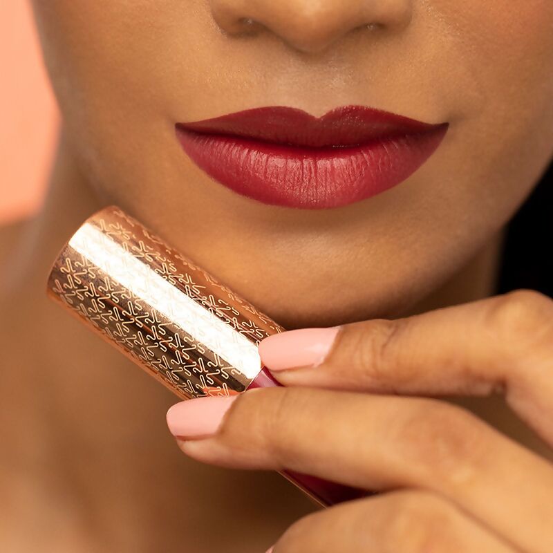 Kay Beauty Matte Drama Long Stay Lipstick in Head Turner shade, showing vibrant red lipstick applied on lips.