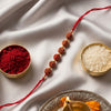 Dhiyona Religious Rudraksh Thread Rakhi With Roli Chawal Chandan Mishri