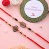 Dhiyona Set Of 2 Red Wooden Om Beaded Rakhi With Roli Rice & Greeting Card