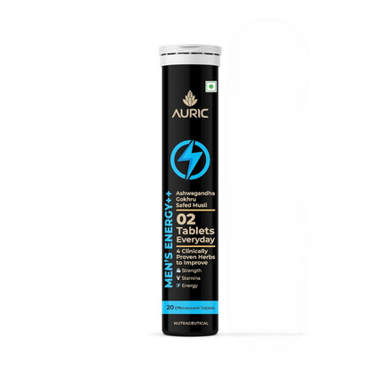 Auric Men's Energy++ Ayurvedic effervescent tablets in a clear glass, showing the vibrant tablets ready to dissolve.