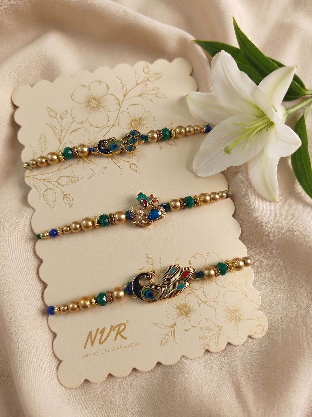 Anouk Set Of 3 Peacock Design Multicolor Artificial Beads Thread Rakhi With Roli Chawal