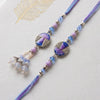 Dhiyona Set Of 2 Purple Artificial Beads Traditional Bhaiya Bhabhi Rakhi With Roli Chawal