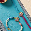 Dhiyona Set Of 2 Artificial Beads Radha Krishna Bhaiya Bhabhi Rakhi With Roli Chawal Chandan