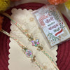 Dhiyona Set Of 2 Meenakari Floral Thread Rakhi With Roli Chawal Chandan Mishri