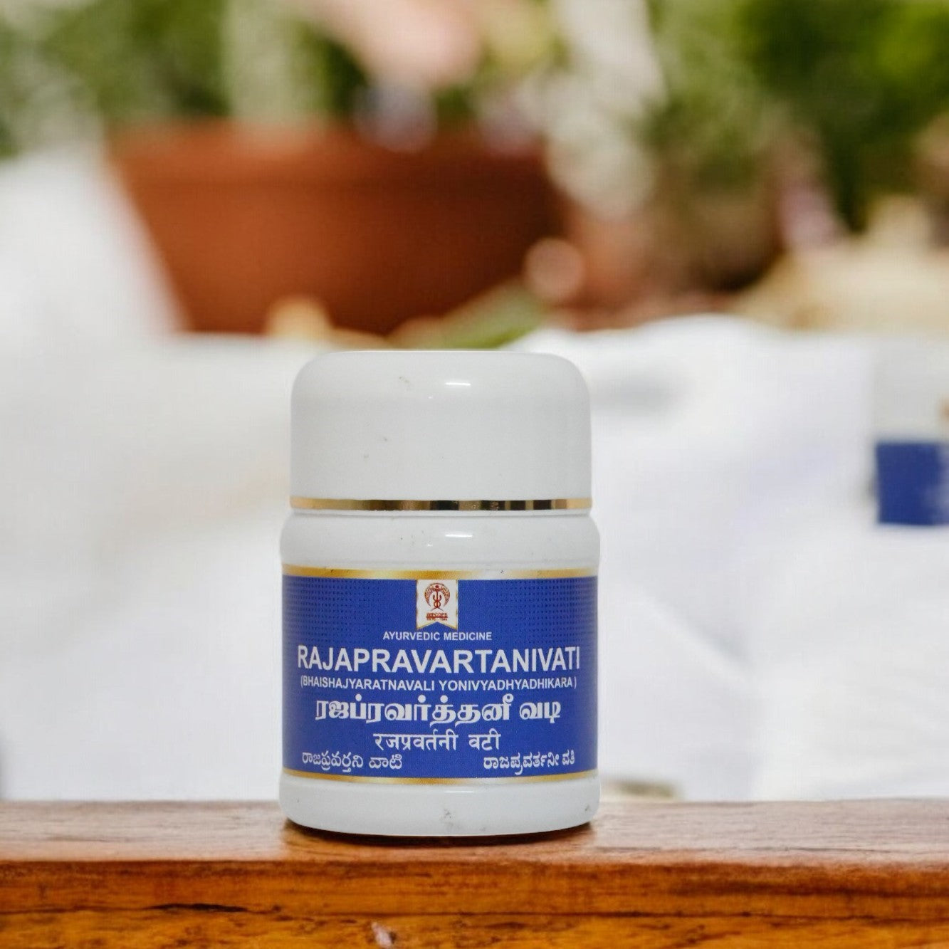 ImpCops Rajapravarthanivati Ayurvedic product in a glass jar with herbal ingredients and label, used for traditional wellness.