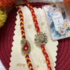 Dhiyona Set Of 2 Gold & Red Thread & Kundan Rakhi With Roli Chawal Chandan Mishri
