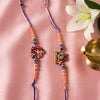 Dhiyona Set Of 2 Krishna Ji & Ganesh Ji Beaded Religious Thread Rakhi With Roli Chawal