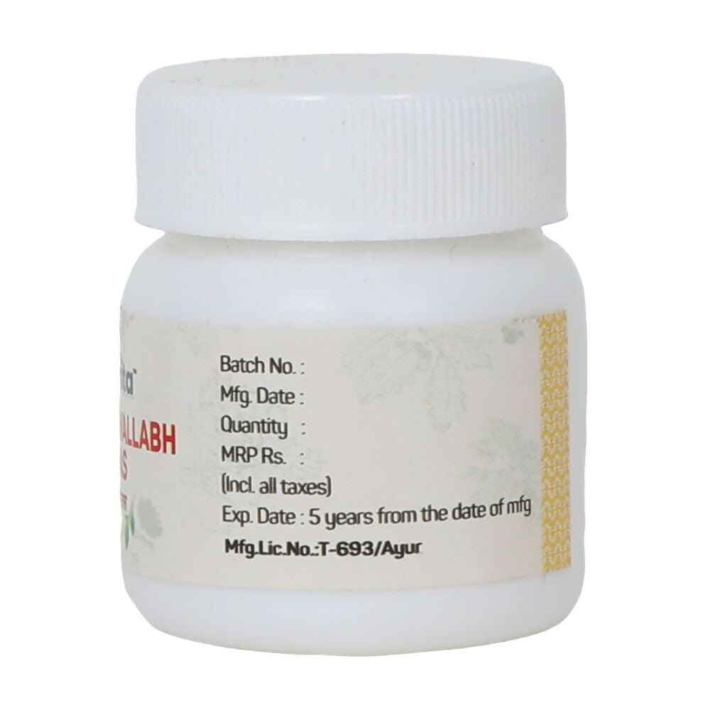 Amrita Nripativallabh Ras Ayurvedic tablets in a glass bottle with tablets visible inside, natural herbal supplement for health.