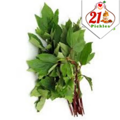 Spicy 21Pickles Gongura pickle in a glass jar, showcasing vibrant green leaves and red chili flakes, traditional North Indian pickle.
