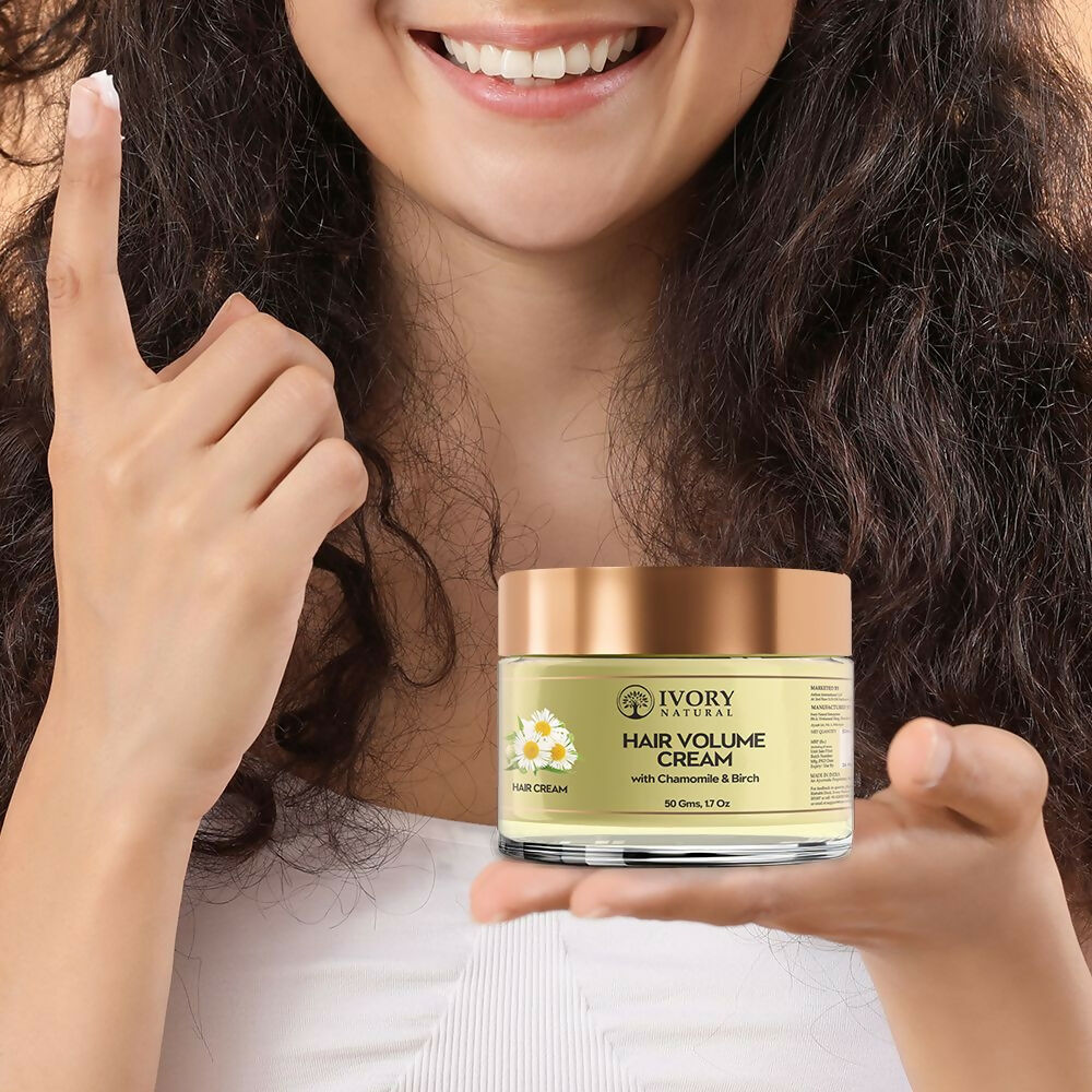 Ivory Natural hair mask with ivory-colored cream for adding volume and fullness to natural hair, showing the product applied to hair.