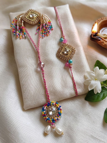 Anouk Set Of 2 White Artificial Stones Golden Toned Bhaiya Bhabhi Rakhi With Roli Chawal