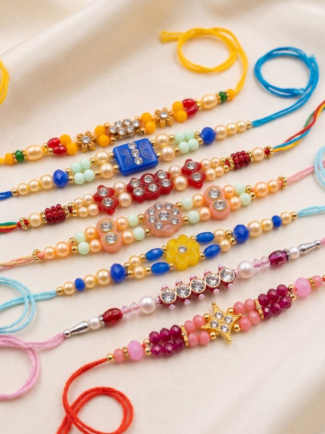 Anouk Set Of 7 Multicolor Designer Thread Rakhi With Roli Chawal Chandan Mishri