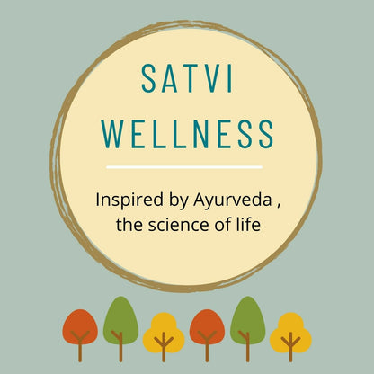 Ayurvedic powder in a glass jar labeled Satvi Wellness Aragwadha Bark Powder, with a wooden scoop on a wooden surface.