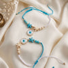 Dhiyona Set Of 2 Blue Evil Eye & White Pearl Bhaiya Bhabhi Rakhi With Roli Chawal Chandan