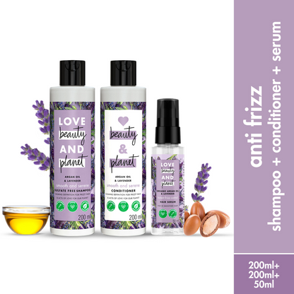 Love Beauty and Planet argan oil and lavender anti-frizz shampoo, conditioner, and hair serum combo with bottles and hair care products.