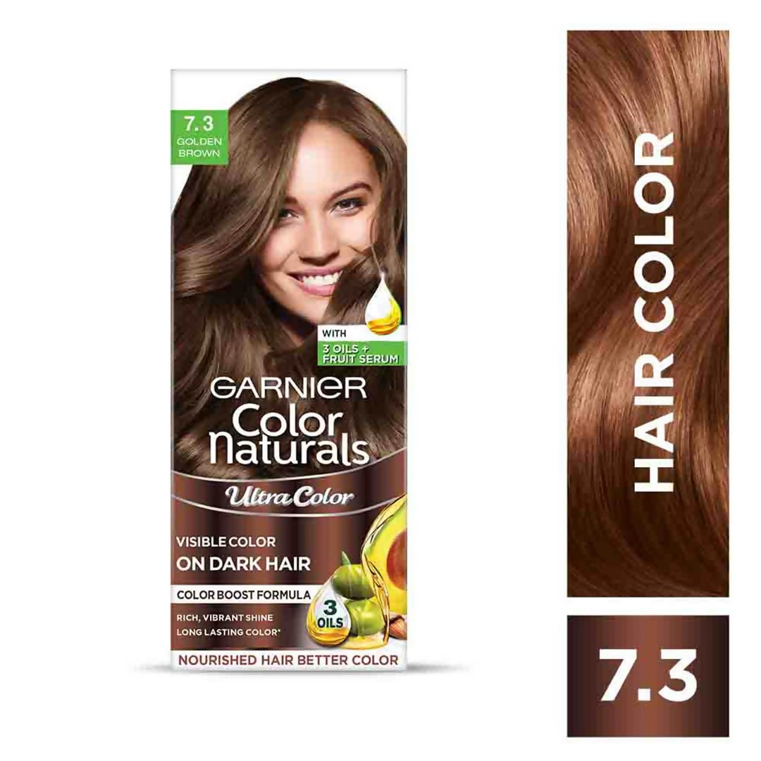 Garnier Color Naturals Ultra Hair Color in 7.3 Golden Brown showing a tube of hair dye and color swatches.