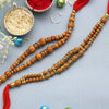 Dhiyona Set Of 2 Brown Beaded Rakhi With Roli Rice & Greeting Card