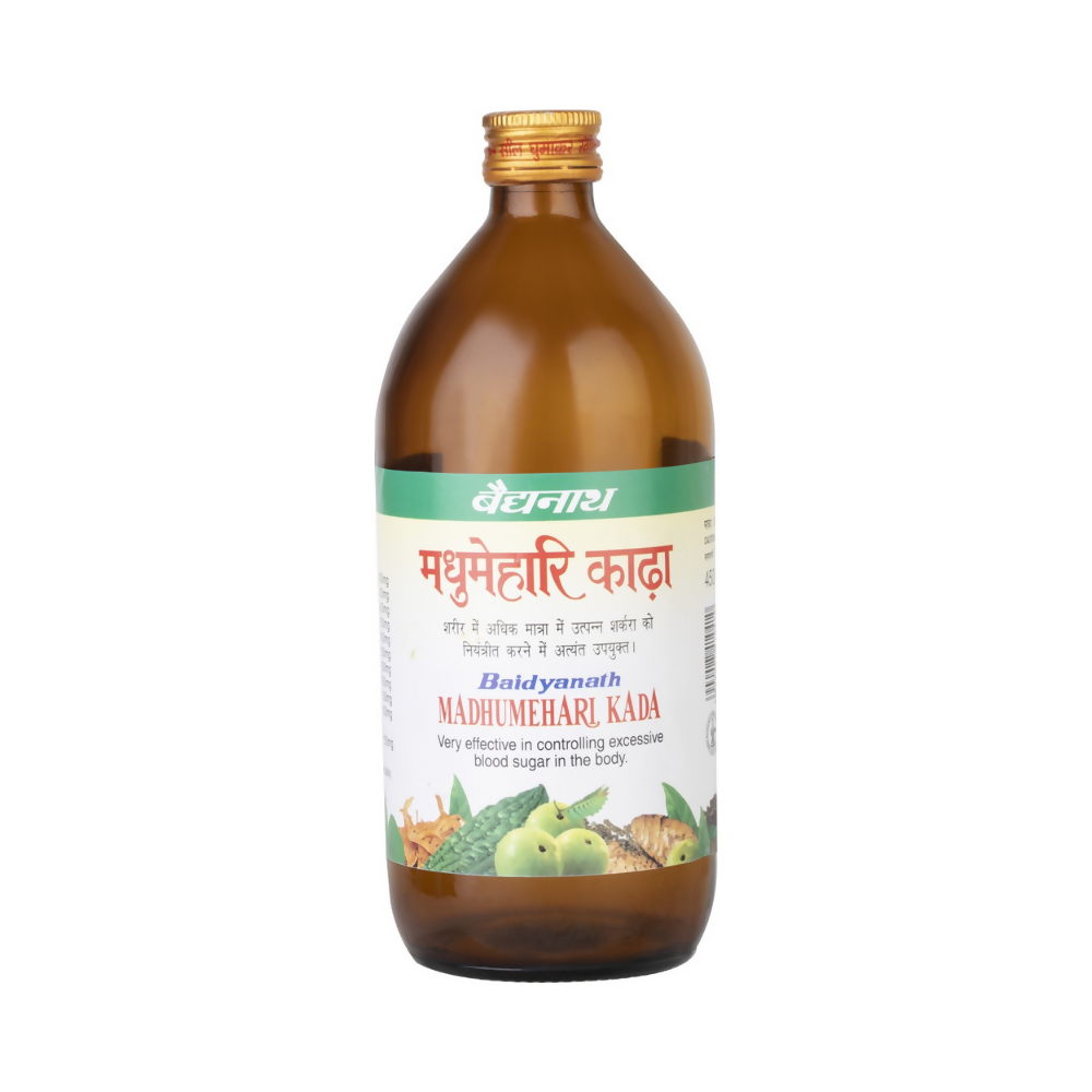 Baidyanath Madhumehari Kadha Ayurvedic drink in a glass with herbs and spices, showcasing traditional herbal ingredients.