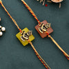 Dhiyona Set Of 2 Red Kanhaiya Rakhis With Roli Chawal & Greeting Card