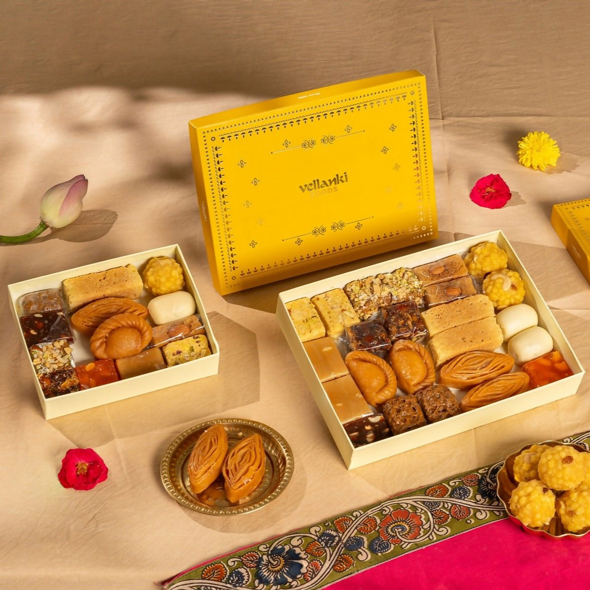 Assorted North Indian sweets from Vellanki Foods displayed on a plate, featuring colorful traditional desserts and confections.