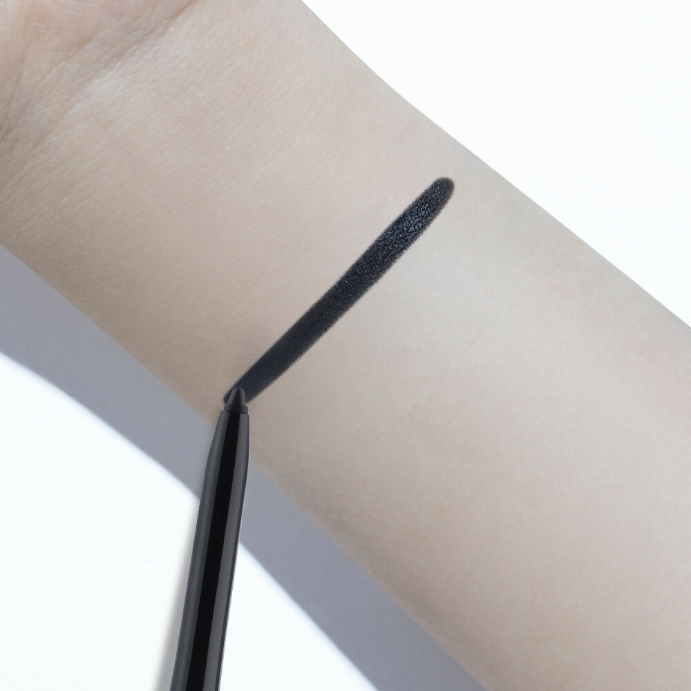 Kay Beauty waterproof kajal in spade black, showing the sleek black pencil tip and smooth application for intense eye definition.
