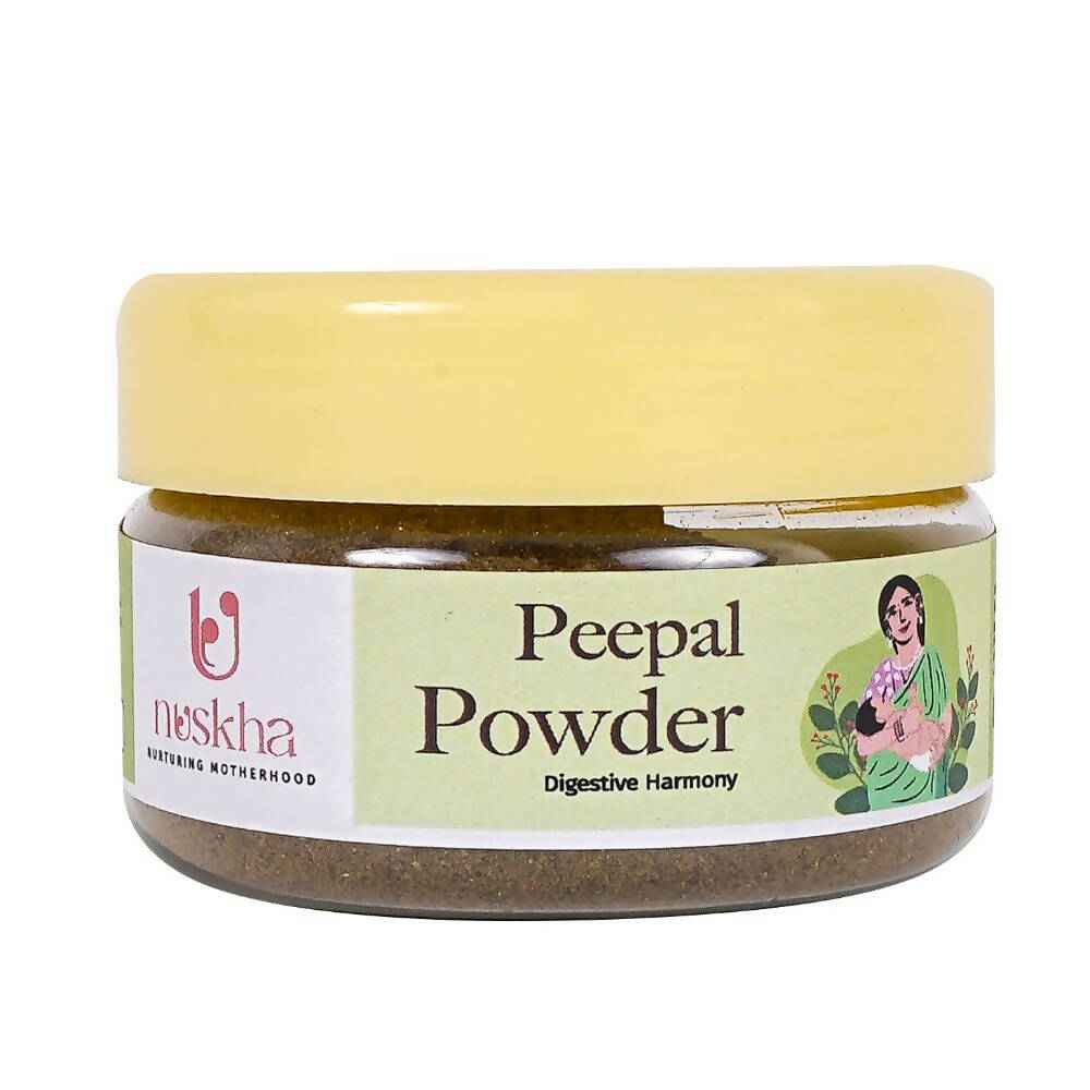Nuskha Peepal Pepper Powder in a clear glass jar, showing fine, reddish-brown pepper powder for culinary use.