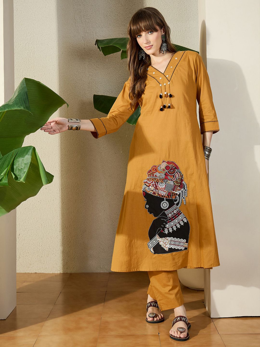 Women Mustard Embroidered A-Line Kurta Trousers Set