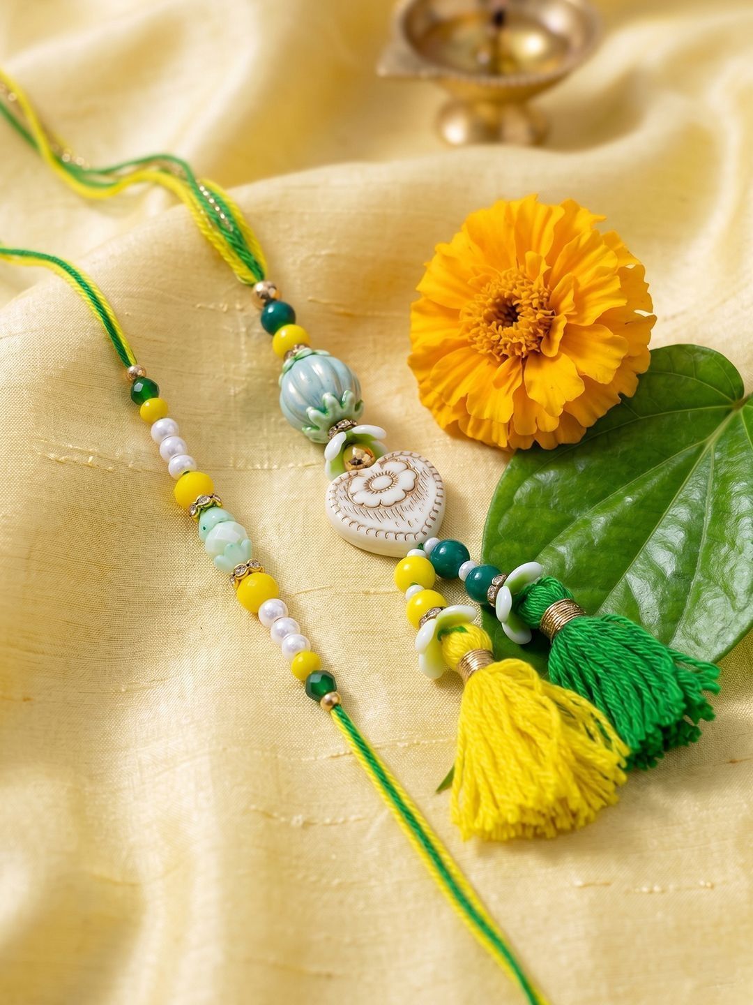 Anouk Set Of 2 Green & Yellow Beaded Heart Shape Bhaiya Bhabhi Rakhi With Roli Chawal