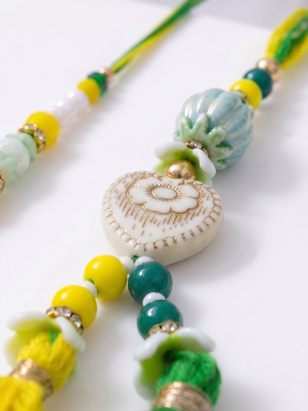 Anouk Set Of 2 Green & Yellow Beaded Heart Shape Bhaiya Bhabhi Rakhi With Roli Chawal